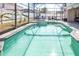 Screened pool and patio with seating area at 1074 Berkeley Dr, Kissimmee, FL 34744