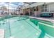 Inviting pool with spacious patio and screened enclosure at 1074 Berkeley Dr, Kissimmee, FL 34744