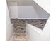 Stairs leading down to a large room with wood-look tile floors at 1074 Berkeley Dr, Kissimmee, FL 34744