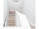 View of modern stairs with white railing and wood-look flooring at 1074 Berkeley Dr, Kissimmee, FL 34744
