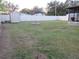 Backyard with shed, fire pit, and large grassy area at 1125 S Woodlawn Ave, Bartow, FL 33830