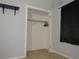 Bedroom with a basic closet and light grey walls at 1125 S Woodlawn Ave, Bartow, FL 33830