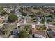 Aerial view of house and surrounding neighborhood at 140 Bentley Oaks Blvd, Davenport, FL 33896