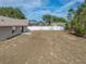 Spacious backyard with partial view of house at 140 Bentley Oaks Blvd, Davenport, FL 33896