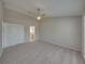 Spacious Primary bedroom with ceiling fan and ensuite bathroom access at 140 Bentley Oaks Blvd, Davenport, FL 33896