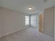 Cozy bedroom with window, closet, and neutral decor at 140 Bentley Oaks Blvd, Davenport, FL 33896