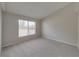 Bright bedroom with carpeted floor and window at 140 Bentley Oaks Blvd, Davenport, FL 33896