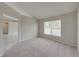 Spacious bedroom with carpeted floor and large window at 140 Bentley Oaks Blvd, Davenport, FL 33896