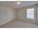 Bright bedroom with a window and neutral wall colors at 140 Bentley Oaks Blvd, Davenport, FL 33896