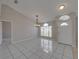 Bright dining area with tiled floors and a chandelier at 140 Bentley Oaks Blvd, Davenport, FL 33896