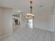 Dining area adjacent to kitchen, featuring tiled floors at 140 Bentley Oaks Blvd, Davenport, FL 33896