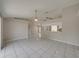 Bright dining room with tile floors and a view into the living room at 140 Bentley Oaks Blvd, Davenport, FL 33896