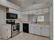 Efficient kitchen, featuring stainless steel appliances at 140 Bentley Oaks Blvd, Davenport, FL 33896