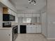Kitchen with stainless steel appliances and white cabinets at 140 Bentley Oaks Blvd, Davenport, FL 33896