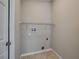 Laundry closet with shelving and hookups for washer and dryer at 140 Bentley Oaks Blvd, Davenport, FL 33896