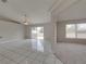 Living room with tile floor, sliding door to backyard at 140 Bentley Oaks Blvd, Davenport, FL 33896