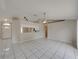 Open living room and kitchen area with tile floors at 140 Bentley Oaks Blvd, Davenport, FL 33896
