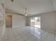Living room with tile floor and ceiling fan at 140 Bentley Oaks Blvd, Davenport, FL 33896