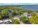 Aerial view of waterfront home with large backyard and pool at 1419 Hollingsworth Oaks Dr, Lakeland, FL 33803