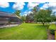 Landscaped backyard with lush greenery, providing a private oasis at 1419 Hollingsworth Oaks Dr, Lakeland, FL 33803