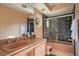 Pink bathroom with a shower, sink, and patterned tile at 1419 Hollingsworth Oaks Dr, Lakeland, FL 33803