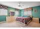 Guest bedroom with a queen-size bed and teal walls at 1419 Hollingsworth Oaks Dr, Lakeland, FL 33803