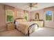 Bright bedroom with a metal bed frame and two windows at 1419 Hollingsworth Oaks Dr, Lakeland, FL 33803