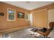 Bedroom with a large window and a mid-century chair at 1419 Hollingsworth Oaks Dr, Lakeland, FL 33803