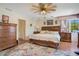 Spacious bedroom with king-size bed and hardwood floors at 1419 Hollingsworth Oaks Dr, Lakeland, FL 33803