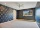 Bedroom with floral wallpaper and carpeting at 1419 Hollingsworth Oaks Dr, Lakeland, FL 33803