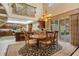 Breakfast nook with a round table and chairs, adjacent to kitchen at 1419 Hollingsworth Oaks Dr, Lakeland, FL 33803