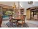 Sunlit dining room with pool view and elegant wood furnishings at 1419 Hollingsworth Oaks Dr, Lakeland, FL 33803