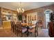 Formal dining room with an oval table, chandelier, and mirrored wall at 1419 Hollingsworth Oaks Dr, Lakeland, FL 33803