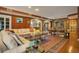 Spacious living room featuring a large sectional sofa and ornate rug at 1419 Hollingsworth Oaks Dr, Lakeland, FL 33803
