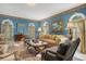 Spacious living room featuring comfortable seating and large windows at 1419 Hollingsworth Oaks Dr, Lakeland, FL 33803