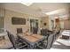 Covered patio with wicker furniture and dining table at 1419 Hollingsworth Oaks Dr, Lakeland, FL 33803