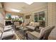Relaxing patio with wicker furniture and brick walls at 1419 Hollingsworth Oaks Dr, Lakeland, FL 33803