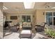 Covered patio with wicker furniture and a dining area at 1419 Hollingsworth Oaks Dr, Lakeland, FL 33803