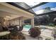 Lush patio with pool, hot tub, and covered seating at 1419 Hollingsworth Oaks Dr, Lakeland, FL 33803
