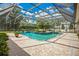 Relaxing screened pool and spa with brick pavers and a tranquil setting at 1419 Hollingsworth Oaks Dr, Lakeland, FL 33803