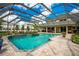 Inviting screened pool with a spacious patio and plenty of room for entertaining at 1419 Hollingsworth Oaks Dr, Lakeland, FL 33803