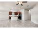 Spacious kitchen featuring dark wood cabinets, granite countertops, and a large island at 1622 Tressel Ct, Winter Haven, FL 33881