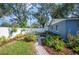 Landscaped backyard with brick pathway, and seating area at 1632 Tangerine St, Lakeland, FL 33803