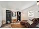 Relaxing basement area with chaise lounge, bookshelves, and large window at 1632 Tangerine St, Lakeland, FL 33803