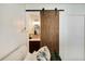 View of bathroom with barn door from bedroom at 1632 Tangerine St, Lakeland, FL 33803