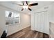 Bedroom with ceiling fan, large closet, and window with blinds at 1632 Tangerine St, Lakeland, FL 33803