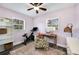 Bright bedroom with a comfy chair, built-in shelves, and exercise bike at 1632 Tangerine St, Lakeland, FL 33803