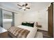 Cozy bedroom featuring a large bed and barn door at 1632 Tangerine St, Lakeland, FL 33803