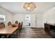 Dining room with wood table, chairs, and laundry access at 1632 Tangerine St, Lakeland, FL 33803