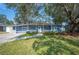 Charming ranch home with blue exterior, landscaping, and a walkway at 1632 Tangerine St, Lakeland, FL 33803